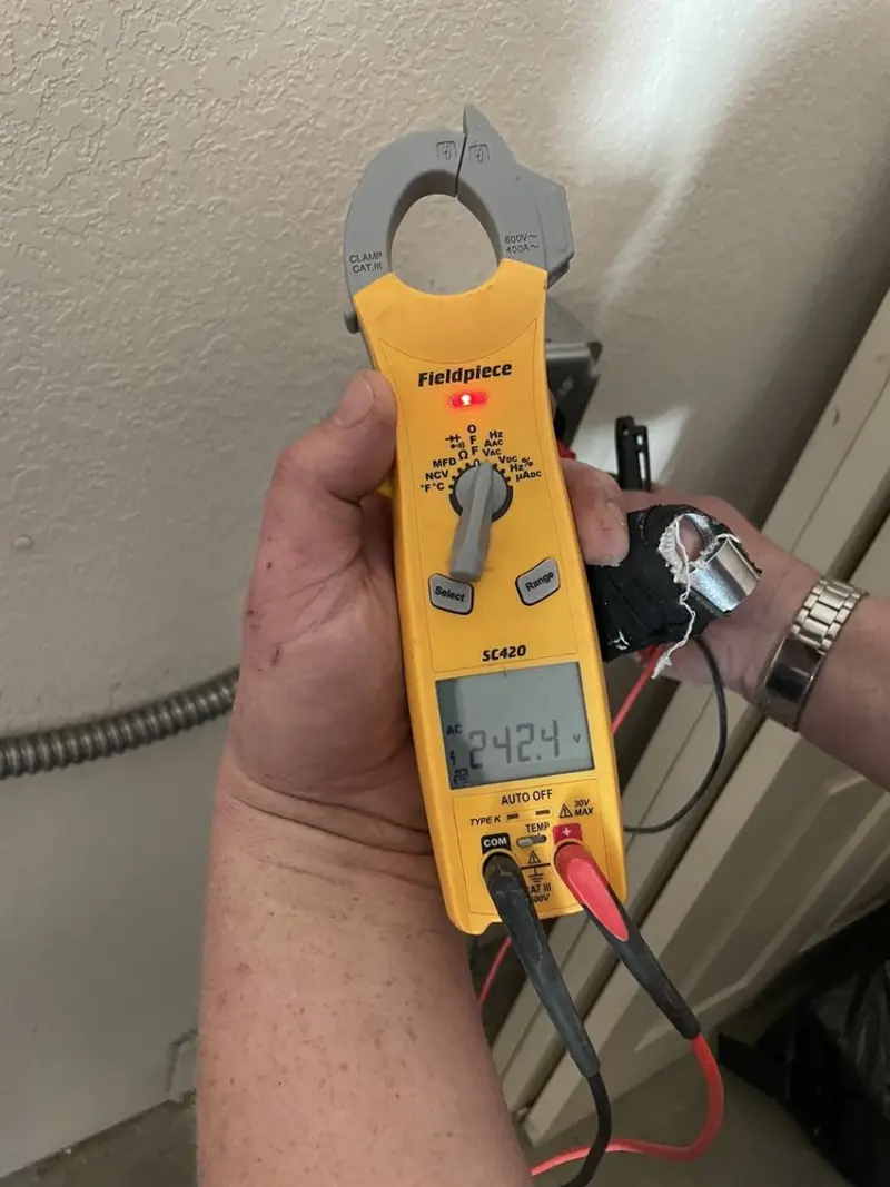Voltage testing with clamp meter during Outlet Installation in Chittenango